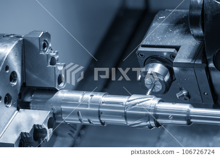 The CNC lathe machine slot milling the brass shaft parts by milling spindle. The CNC lathe machine slot milling the brass shaft parts by milling spindle. 106726724
