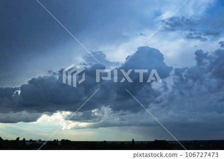 Colorful sky with storm clouds, before the rain, dramatic sky, day, Ukrainian landscape 106727473