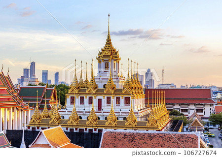 BANGKOK,THAILAND - DEC 31, 2017: Loha Prasat (Metal Palace) is a 7-story building at Wat Ratchanatdaram, a famous tourist attraction in Bangkok. It is the only metal castle in Thailand and the World BANGKOK,THAILAND - DEC 31, 2017: Loha Prasat (Metal Palace) is a 7-story building at Wat Ratchanatdaram, a famous tourist attraction in Bangkok. It is the only metal castle in Thailand and the World 106727674