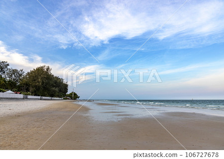 Hua Hin Beach, Prachuap Khiri Khan Province, Thailand, empty, saw a few unidentified people in the distance. During the day the sky is blue. It is one of the most popular beaches in Thailand. 106727678