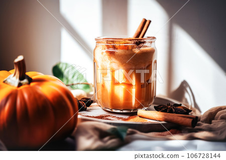 Autumn pumpkin spicy latte with whipped cream and cinnamon, Seasonal warming drink, light background 106728144