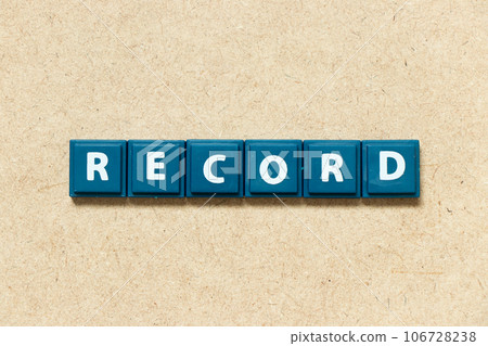 Tile alphabet letter in word record on wood background Tile alphabet letter in word record on wood background 106728238
