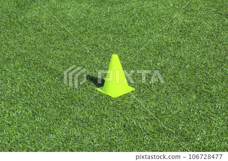 Colored cones on artificial grass Colored cones on artificial grass 106728477