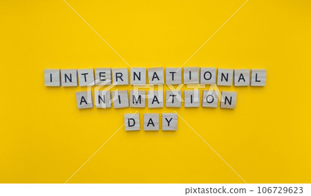 October 28, International Animation Day, minimalistic banner with the inscription in wooden letters 106729623