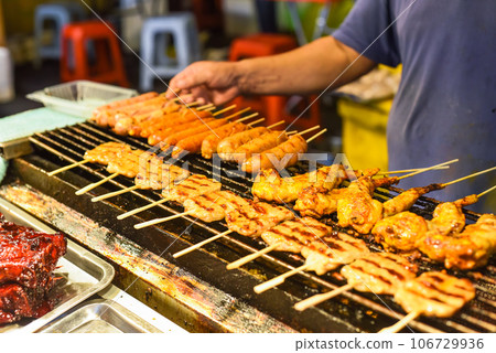 Grilled chicken meat and sausages bbq in Jalan Alor street food in Kuala Lumpur Grilled chicken meat and sausages bbq in Jalan Alor street food in Kuala Lumpur 106729936