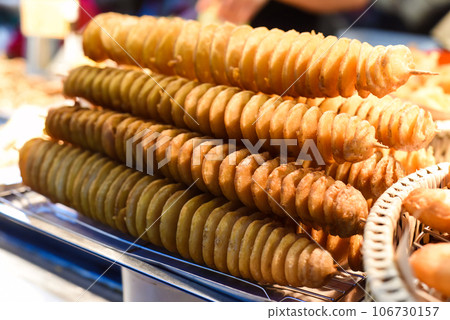 Twisted potatoes in the night market of street food Jalan Alor in Malaysia Twisted potatoes in the night market of street food Jalan Alor in Malaysia 106730157