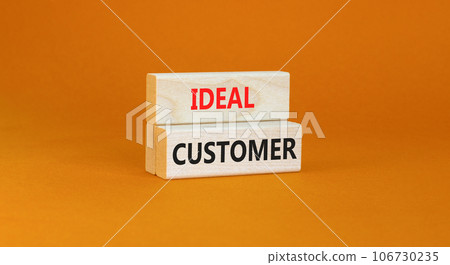 Ideal customer symbol. Concept words Ideal customer on beautiful wooden blocks. Beautiful orange table orange background. Business ideal customer concept. Copy space. 106730235