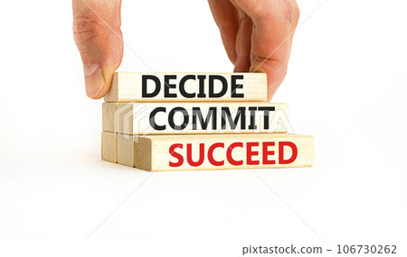 Decide commit succeed symbol. Concept word Decide Commit Succeed on beautiful wooden block. Businessman hand. Beautiful white table background. Business decide commit succeed concept. Copy space. Decide commit succeed symbol. Concept word Decide Commit Succeed on beautiful wooden block. Businessman hand. Beautiful white table background. Business decide commit succeed concept. Copy space. 106730262