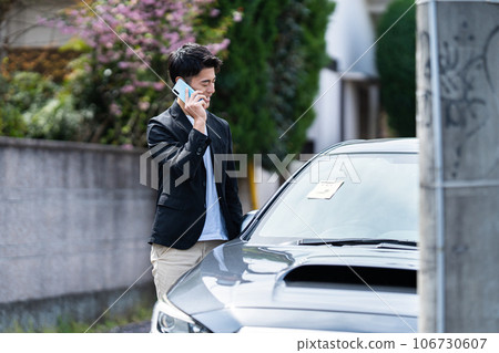 A car with a parking sticker 106730607