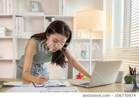 Stressed Young Businesswoman Facing Financial Loss in Corporate Office, Depressed man Dealing with Financial Setback, Stress and Money Problems, Anxiety and Worry Concept. 106730974