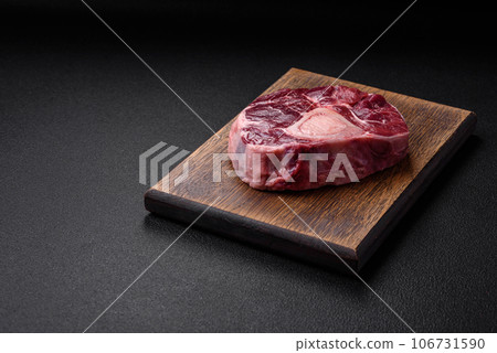 Fresh beef ossobuco steak with salt, spices and herbs 106731590