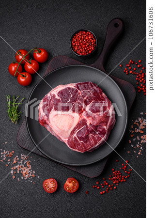 Fresh beef ossobuco steak with salt, spices and herbs 106731608