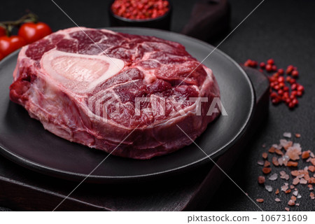 Fresh beef ossobuco steak with salt, spices and herbs 106731609
