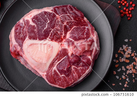 Fresh beef ossobuco steak with salt, spices and herbs Fresh beef ossobuco steak with salt, spices and herbs 106731610