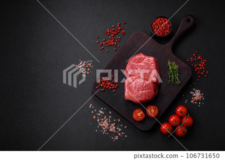 Raw fillet steak mignon beef with salt, spices and herbs 106731650