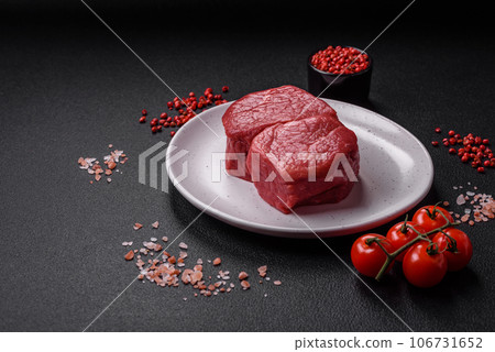 Raw fillet steak mignon beef with salt, spices and herbs 106731652