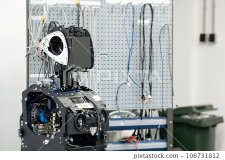 humanoid robot in the process of assembly and adjustment in the workshop humanoid robot in the process of assembly and adjustment in the workshop 106731812