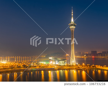 Sunset high angle view of the Macau Tower Convention and Entertainment Center and cityscape Sunset high angle view of the Macau Tower Convention and Entertainment Center and cityscape 106733216