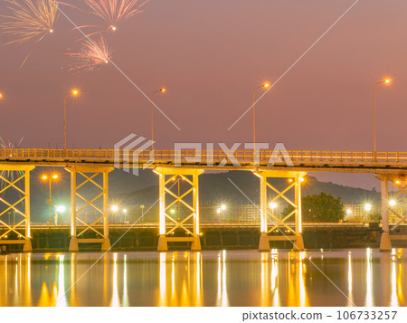 Sunset view of the Governador Nobre de Carvalho Bridge with fireworks Sunset view of the Governador Nobre de Carvalho Bridge with fireworks 106733257