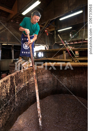 Brewery craftsman who makes miso and soy sauce using wooden barrels, traditional method, brewery image Brewery craftsman who makes miso and soy sauce using wooden barrels, traditional method, brewery image 106733668
