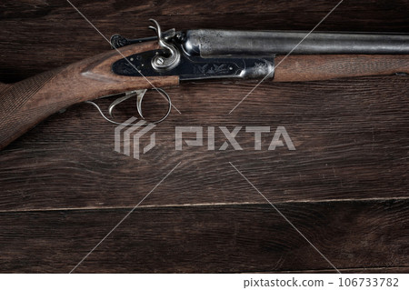 Antique 12-gauge break-action smooth-bored shotgun. 106733782