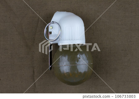 Soviet hand grenade RGN on khaki canvas Soviet hand grenade RGN on khaki canvas 106733803