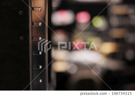 Metal shelf for folders with reports documentation in empty police investigator office. Rack for crime case files in blurred private detective agency close up selective focus Metal shelf for folders with reports documentation in empty police investigator office. Rack for crime case files in blurred private detective agency close up selective focus 106734315