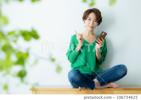 A woman using a smartphone 106734625