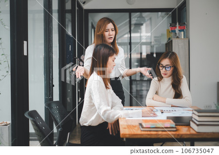 Serious business team leader coach mentor talk to diverse business people in office explain strategy at corporate group meeting, multiethnic staff listen to boss instruct interns at briefing 106735047