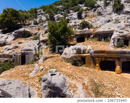 Remains of Lycian rock tombs in ancient city of Limyra, Turkey 106735945