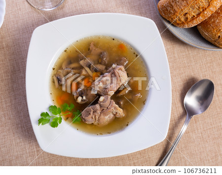 Thick pearl barley mushroom soup with pork and vegetables 106736211