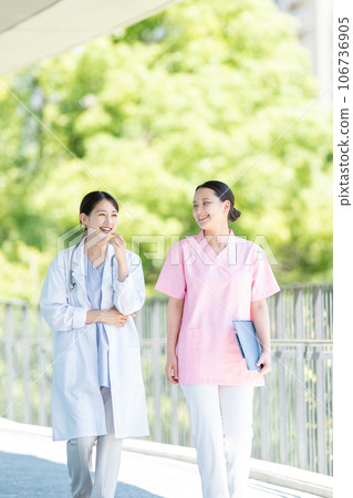 Nurse and female doctor working at a hospital 106736905