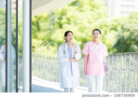 Nurse and female doctor working at a hospital 106736909