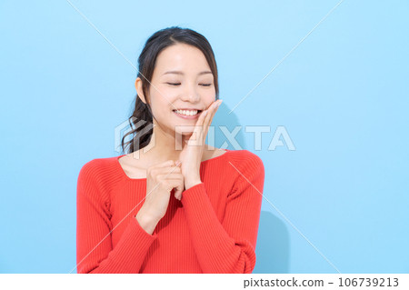 Portrait of a woman in her 20s wearing red clothes 106739213