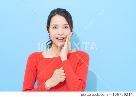 Portrait of a woman in her 20s wearing red clothes Portrait of a woman in her 20s wearing red clothes 106739214