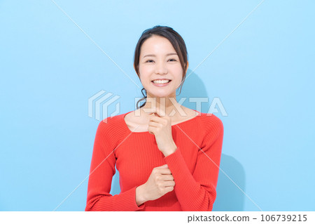 Portrait of a woman in her 20s wearing red clothes Portrait of a woman in her 20s wearing red clothes 106739215