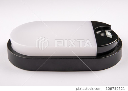 Led lamp with a motion sensor on a white background. Close up Led lamp with a motion sensor on a white background. Close up 106739521