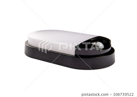Lamp with a motion sensor on a white background. Close up Lamp with a motion sensor on a white background. Close up 106739522