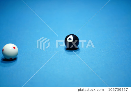 After being struck on the billiard table in a game of billiards, several billiard balls 106739537