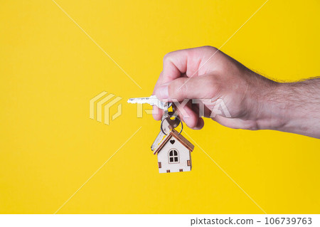 Buying a house. The buyer receives the key to the property. Buying a house. The buyer receives the key to the property. 106739763
