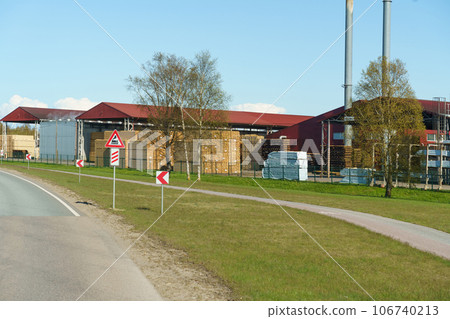 Woodworking plant. Stacked lumber in a warehouse. Woodworking plant. Stacked lumber in a warehouse. 106740213