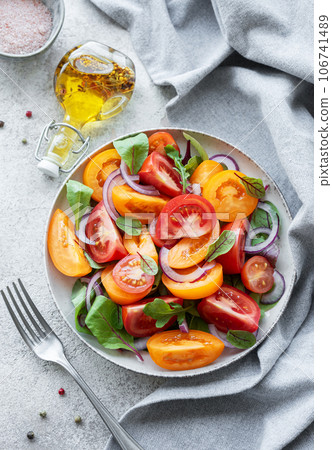 Green salad from leaves and tomatoes Green salad from leaves and tomatoes 106741489