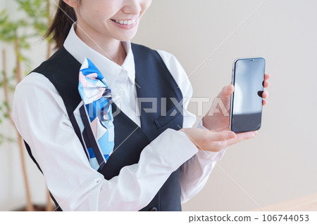 Female staff showing smartphone 106744053