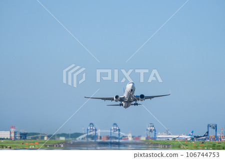 Airplane taking off and blue sky Airplane taking off and blue sky 106744753