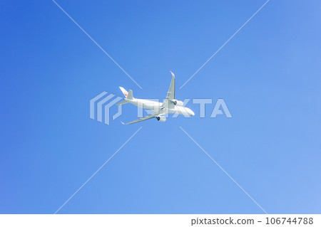Airplane taking off and blue sky 106744788