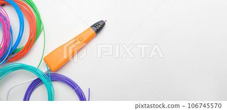 3d Pen. Printing with Colored Plastic Wire Filament. Child making a Christmas Three, Heart shape drawing with 3D pen. Artwork, Robotics. STEAM, STEM education. Modern Technologies. Study at home 106745570