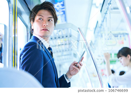Young businessman commuting to school. Photography cooperation with "Keio Electric Railway Co., Ltd." Young businessman commuting to school. Photography cooperation with "Keio Electric Railway Co., Ltd." 106746699