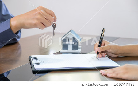Real estate agents and buyers discuss signing a business contract, renting, buying, mortgage, loan or home insurance Real estate agents and buyers discuss signing a business contract, renting, buying, mortgage, loan or home insurance 106747485