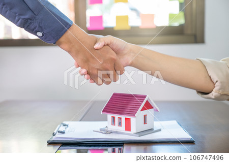 Real estate agents and buyers handshake after signing a business contract, renting, buying, mortgage, loan or home insurance Real estate agents and buyers handshake after signing a business contract, renting, buying, mortgage, loan or home insurance 106747496