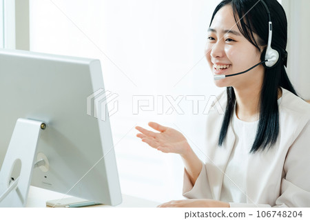 Young woman working in a call center Young woman working in a call center 106748204